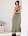 Soft, stylish linen dress with an elasticized back and adjustable straps, designed for relaxed elegance and all-day comfort.