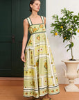 Vibrant citrus midi dress: ALÉMAIS Dixie Summer Dress close up showing the delicate scalloped embroidery and fitted bust.. LUXAMORE
