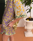 Close-up of Alemais Patty Spliced Shirt sleeve hem showcasing the intricate contrast ruffle detail and fabric texture.. LUXAMORE
