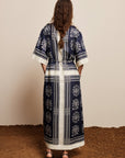 Alemais Sustainable Banderra Linen Shirtdress worn by model back angle LUXAMORE