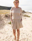Eadie Lifestyle Olivia Linen Top worn by model in natural setting LUXAMORE