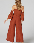 Estilo Emporio Fiorella Top - Rust - LUXAMORE -Tops-Shop the Estilo Emporio Fiorella Top in rust. Made in Positano from 100% Italian linen, this off-the-shoulder design features shirred details and fluted cuffs.