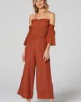 Estilo Emporio Fiorella Top - Rust - LUXAMORE -Tops-Shop the Estilo Emporio Fiorella Top in rust. Made in Positano from 100% Italian linen, this off-the-shoulder design features shirred details and fluted cuffs.