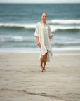 Estilo Emporio La Cota Cover Up Linen Dress Lyla worn by model in natural setting LUXAMORE