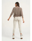 Estilo Emporio Linen Pant Stretch- Natural worn by model in natural setting LUXAMORE
