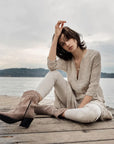 Estilo Emporio Linen Pant Stretch- Natural worn by model in natural setting LUXAMORE