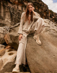 Estilo Emporio Novo Flare Pant - Brasile Natural - LUXAMORE -Pants-Estilo Emporio Novo Flare Pant in Natural 100% Italian linen made in Positano. High-waisted, flare cut. Travel in style. Shop Estilo Emporio Pants.