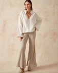 Estilo Emporio Novo Flare Pant - Brasile Natural - LUXAMORE -Pants-Estilo Emporio Novo Flare Pant in Natural 100% Italian linen made in Positano. High-waisted, flare cut. Travel in style. Shop Estilo Emporio Pants.