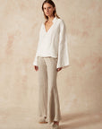 Estilo Emporio Novo Flare Pant - Brasile Natural - LUXAMORE -Pants-Estilo Emporio Novo Flare Pant in Natural 100% Italian linen made in Positano. High-waisted, flare cut. Travel in style. Shop Estilo Emporio Pants.