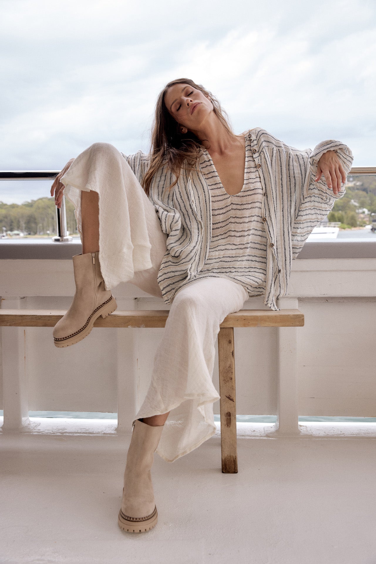 Woman Wearing Estilo Emporio Novo Flare Pant - Brasile Panna White - Pants LUXAMORE