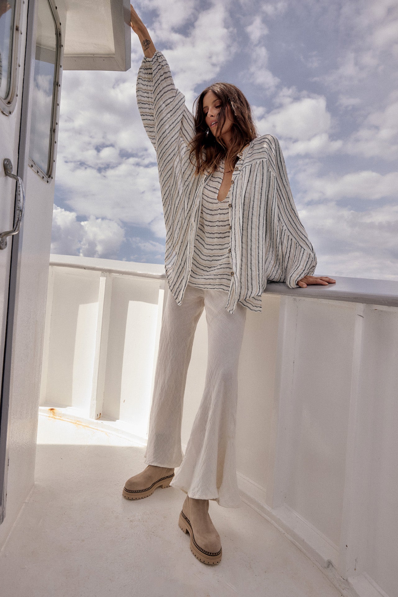 Woman Wearing Estilo Emporio Novo Flare Pant - Brasile Panna White - Pants LUXAMORE