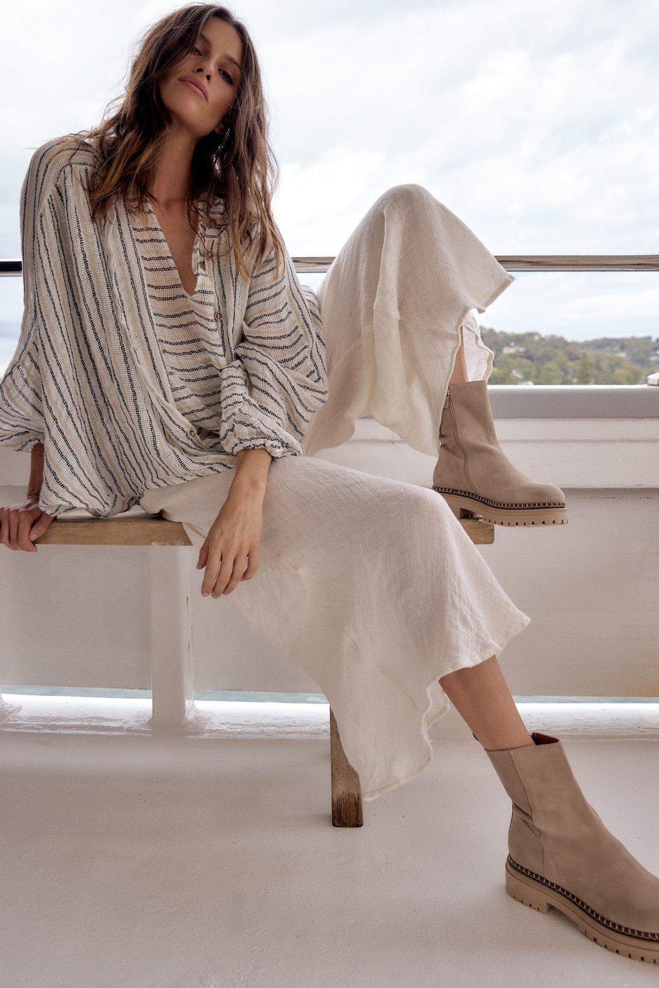 Woman Wearing Estilo Emporio Novo Flare Pant - Brasile Panna White - Pants LUXAMORE