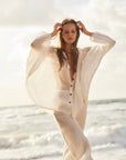 Estilo Emporio Oboe Linen Shirt - LUXAMORE -Top-Estilo Emporio Oboe Shirt 100% Linen, made in Positano. Collarless neckline with front buttons, emphasizing the decolletage. Billowing blouse with a curved hem.