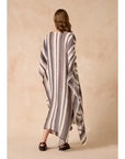 Estilo Emporio Polla Maxi Kaftan Dark Chocolate Stripe worn by model in natural setting LUXAMORE