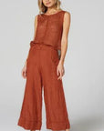 Estilo Emporio Linen Pant Tropez - Rust worn by model in natural setting LUXAMORE