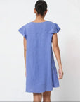 Linen Dress Mini 100% Made in Italy - Jeans blue worn by model in natural setting LUXAMORE