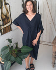 Woman Wearing Linen Dress V-neck Knot Front Midi Made in Italy Black - Dress LUXAMORE