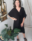 Woman Wearing Linen Dress V-neck Knot Front Midi Made in Italy Black - Dress LUXAMORE