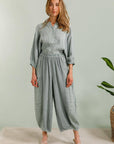 Linen Trousers made in Italy Charcoal Grey worn by model in natural setting LUXAMORE