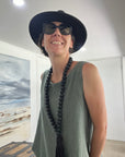 Made in Italy Cascade Linen Dress Olive - LUXAMORE -Dress-LUXAMORE Cascade Linen Dress breathable; with pockets, buttons and a longer back is a timeless wardrobe essential. Shop Italian linen dresses made in italy.