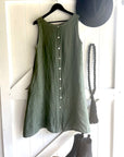 Made in Italy Cascade Linen Dress Olive - LUXAMORE -Dress-LUXAMORE Cascade Linen Dress breathable; with pockets, buttons and a longer back is a timeless wardrobe essential. Shop Italian linen dresses made in italy.
