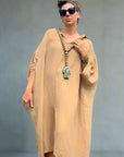 Linen Dress Oversize Maxi Kaftan Made in Italy Caramel worn by model in natural setting LUXAMORE