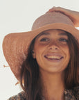 Made in Mada Desire Hat - LUXAMORE -hat-The ELYA hat is the handmade summer hat that compliments your outfit from Made in Mada. Hand woven and dyed – double crochet- adjustable size – inner cotton band for comfort – wire to adjust the brim Beautifully weaved in Madagascar and designed in Australia Weave time 2.5 days Material - Raffia. Cotton & wire Keep your item dry – stain treatment – blot the stain with warm or tepid water and dry.