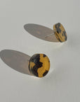Mingled Tortoise Shell Round Stud Earrings - 15mm worn by model in natural setting LUXAMORE