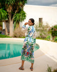 Miss Goodlife Midi Dress Green Garden Made in Italy worn by model in natural setting LUXAMORE