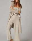 Woman Wearing Estillo Emporio Papillion Jumpsuit - Panna White - Jumpsuits LUXAMORE
