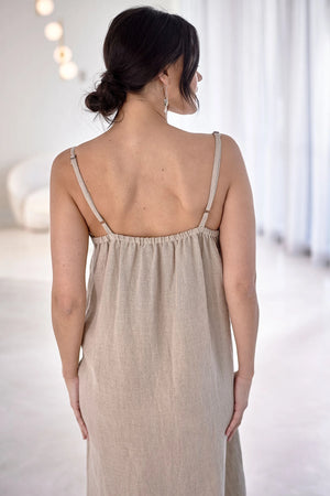 Breathable and lightweight linen dress – a versatile midi-length slip dress crafted from sustainable European linen, ideal for lounging or casual wear.