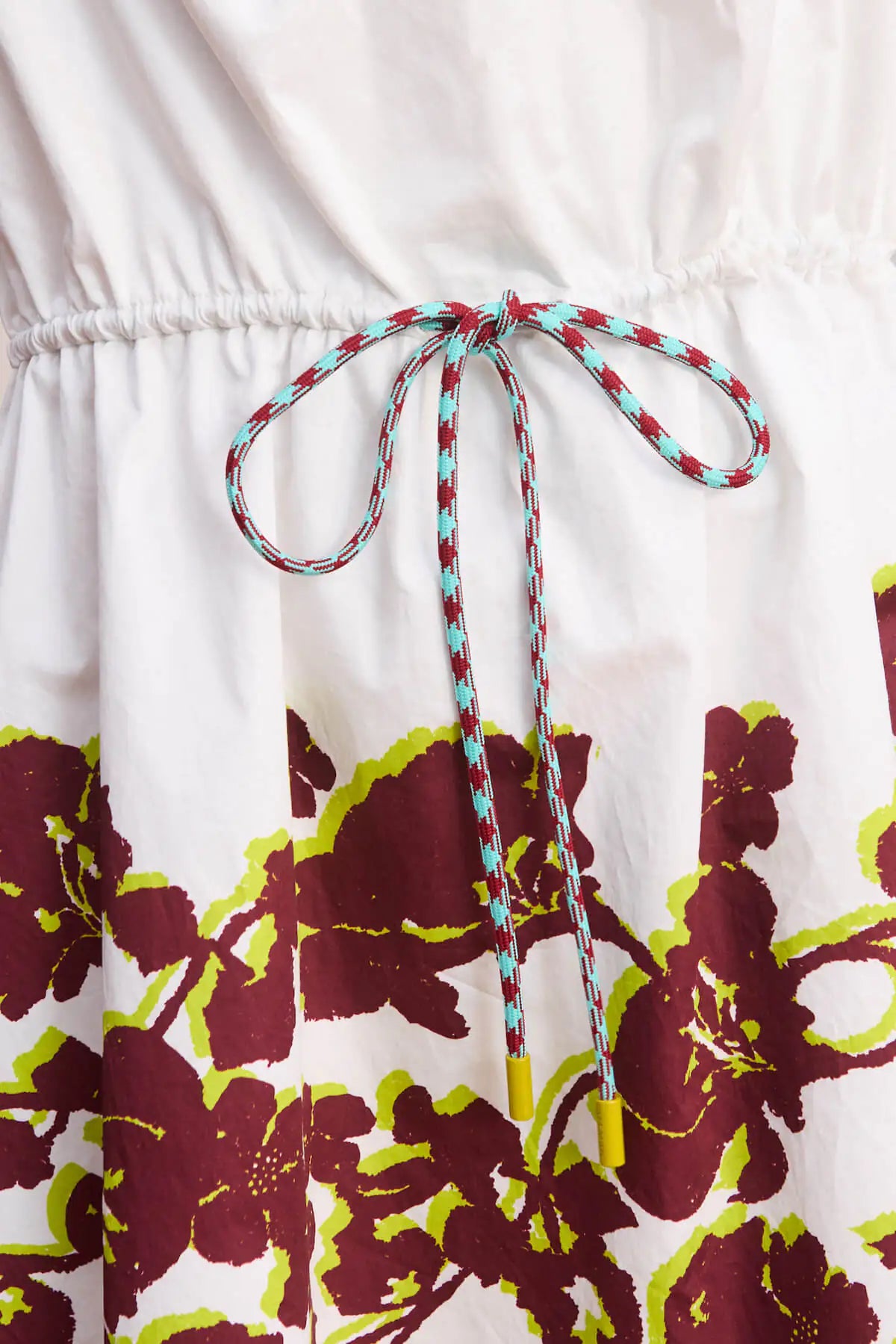alter mini dress and open back design by Alemais close up waist tie toggle. LUXAMORE