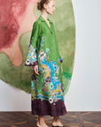 Relaxed straight shirtdress: ALÉMAIS Nanci green dress showing the long sleeves, camp collar, and tied waist.. LUXAMORE