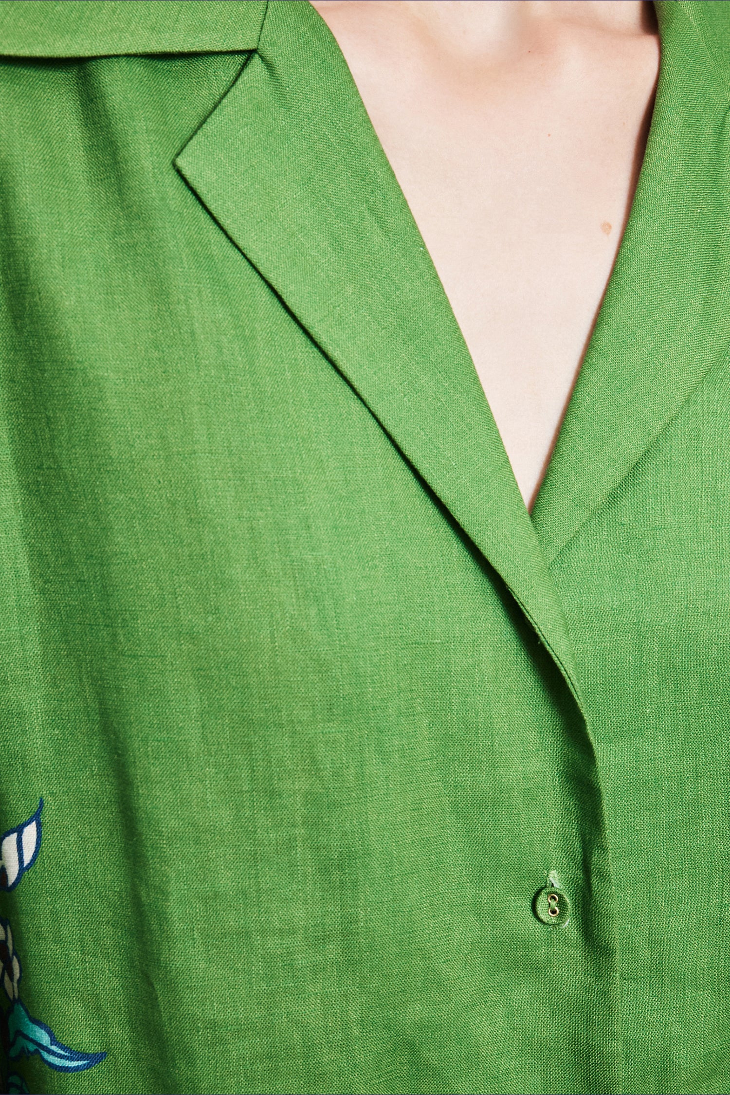 Premium resort-wear dress: Close-up of the self-covered buttons and fine line work on the ALÉMAIS Nanci dress.. LUXAMORE