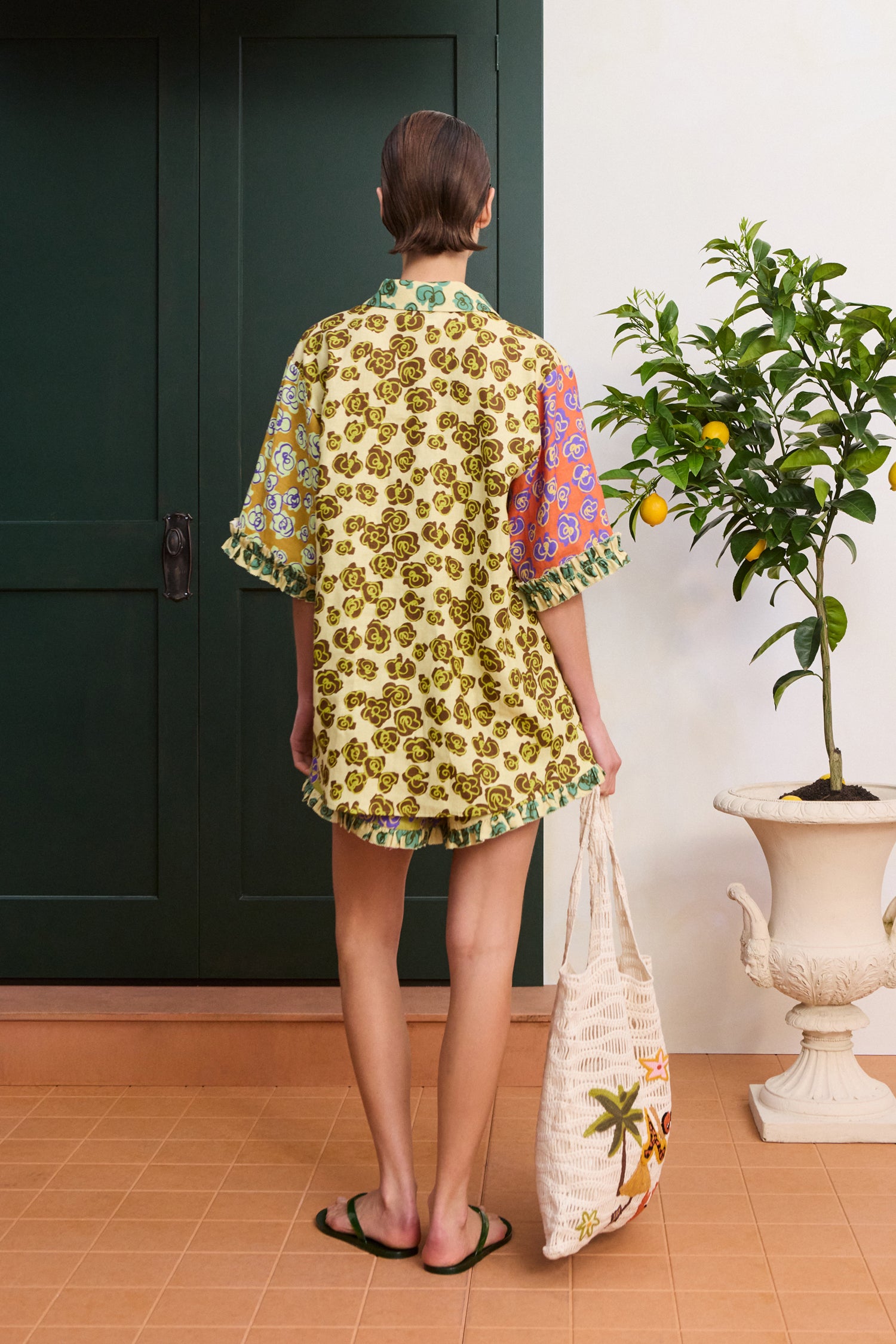 Alemais Patty Spliced Shirt in multi-color print – Back view on model displaying the relaxed tailoring and curved hem silhouette.. LUXAMORE