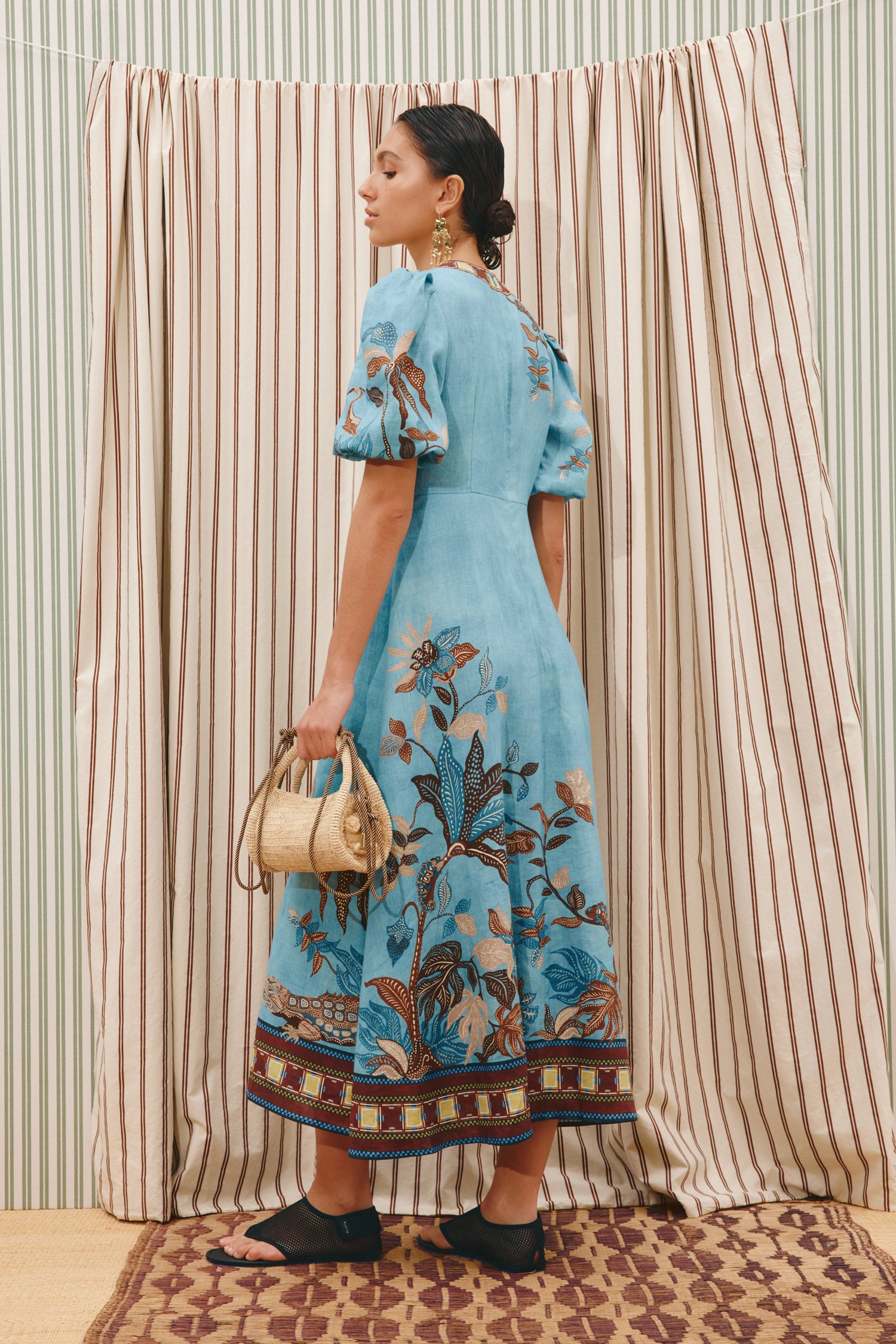 woman wearing Alemais Georgie Midi Dress LUXAMORE 