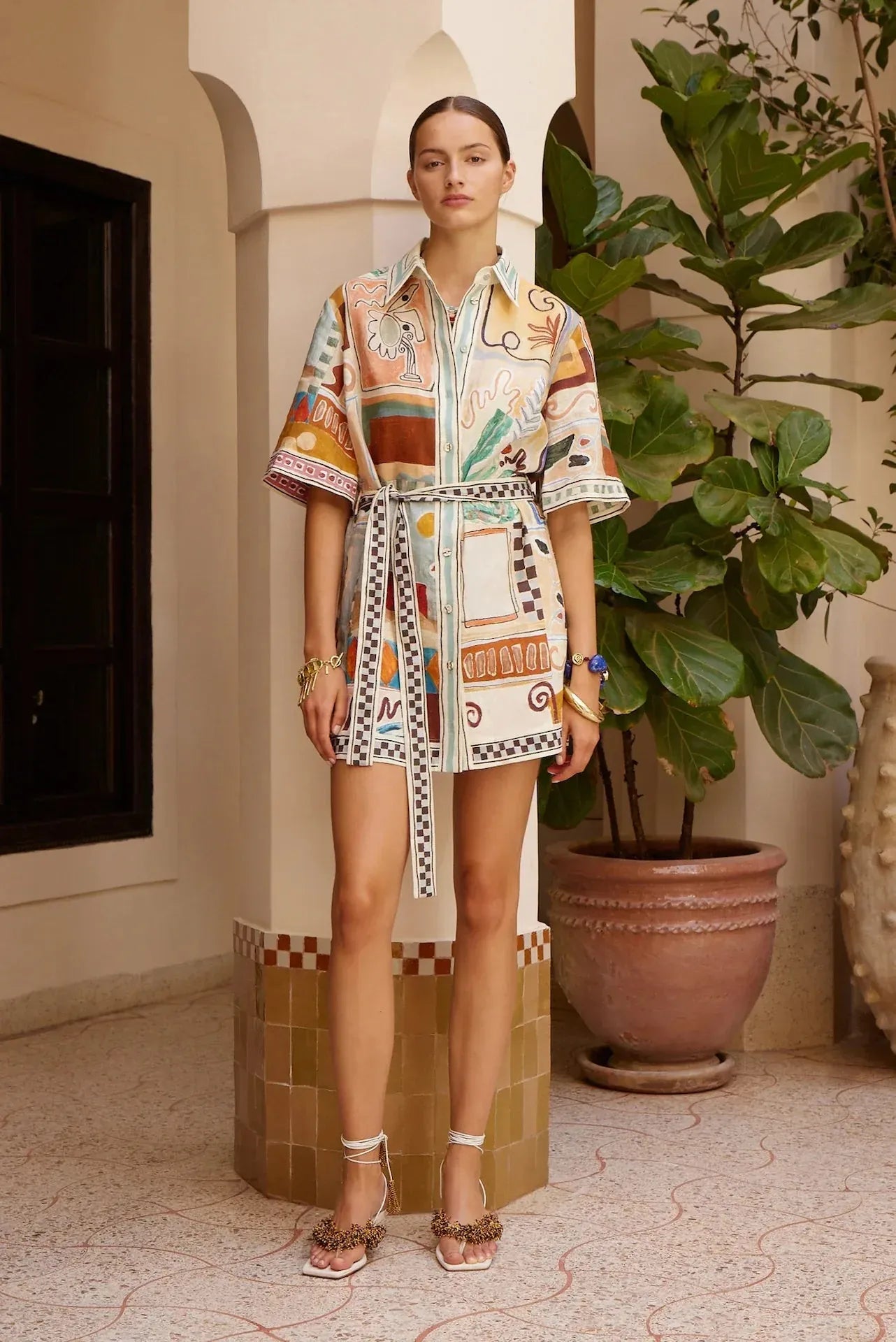 Alemais Michelle Mini Dress worn by model in natural setting LUXAMORE 