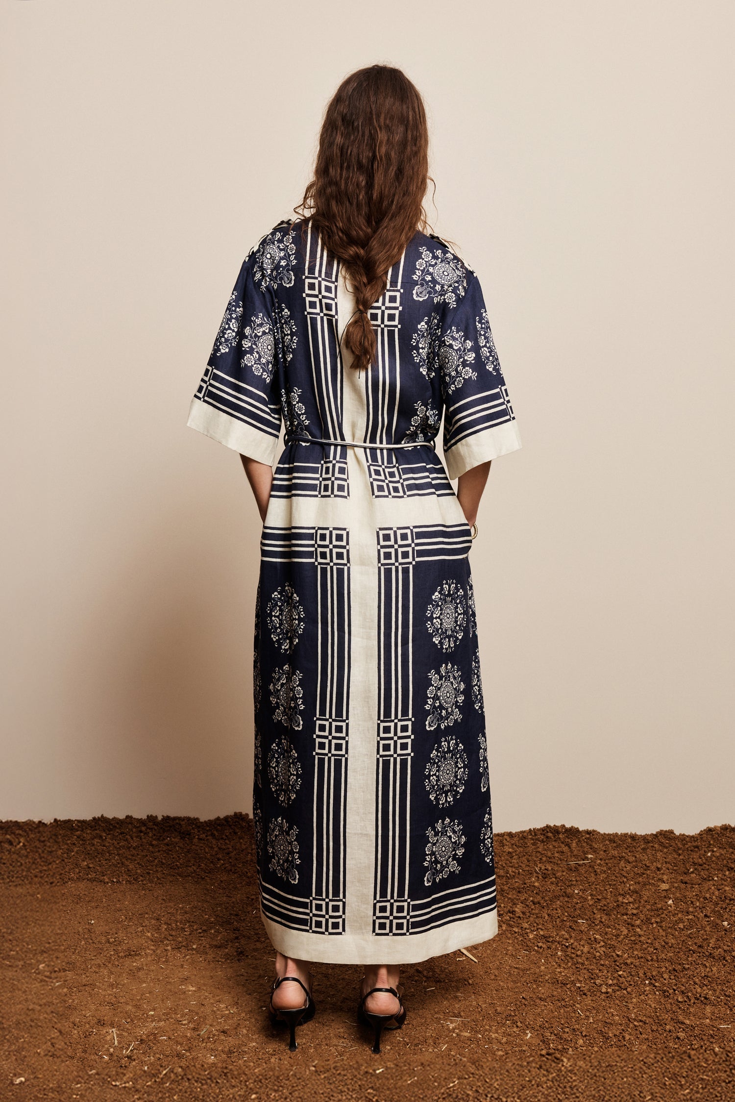 Alemais Sustainable Banderra Linen Shirtdress worn by model back angle LUXAMORE