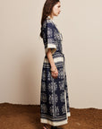 Alemais Sustainable Banderra Linen Shirtdress worn by model side angle LUXAMORE