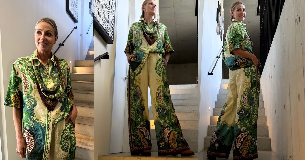 A woman modeling the alemais florence set a matching two-piece outfit with a green and beige paisley print, shown in three views against an indoor staircase background.