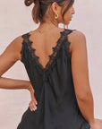Premium tank top: Charli London Solange black camisole showing the fluid drape and pointed hem.