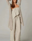 Estillo Emporio Papillion Jumpsuit - Panna White worn by model in natural setting LUXAMORE 