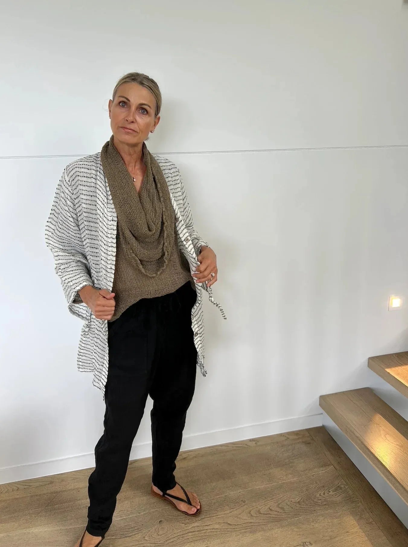 Estilo Emoporio Manta Mini Linen Dress worn by model in natural setting LUXAMORE 