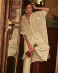 Estilo Emporio La Cota Cover Up Linen Dress worn by model in natural setting LUXAMORE 