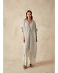 Estilo Emporio La Vista Linen Dress - Binario worn by model in natural setting LUXAMORE 
