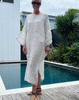 Estilo Emporio Nebbilio Linen Dress - Binario worn by model in natural setting LUXAMORE 