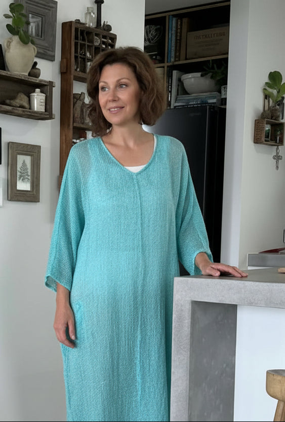 Woman in a modern home interior wearing estilo emporio dress.