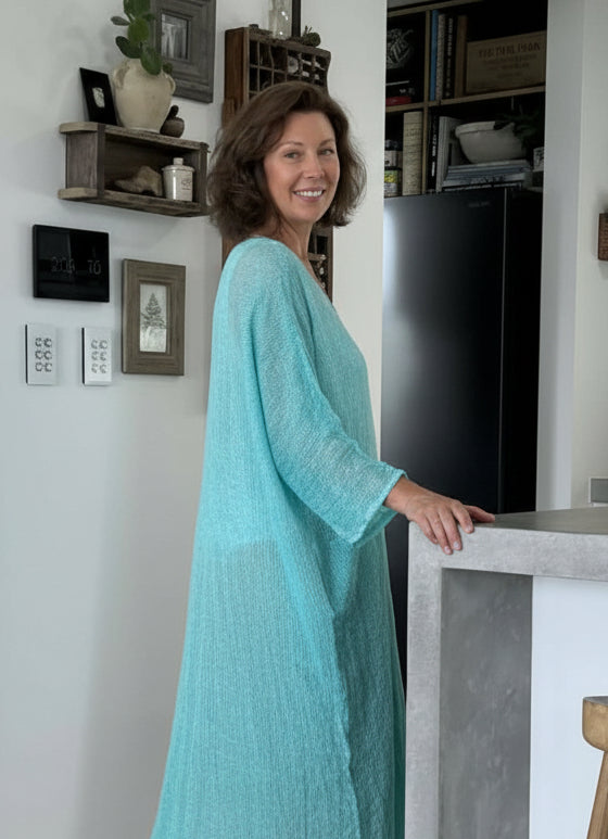 Woman in a modern home wearing estilo emporio dress.