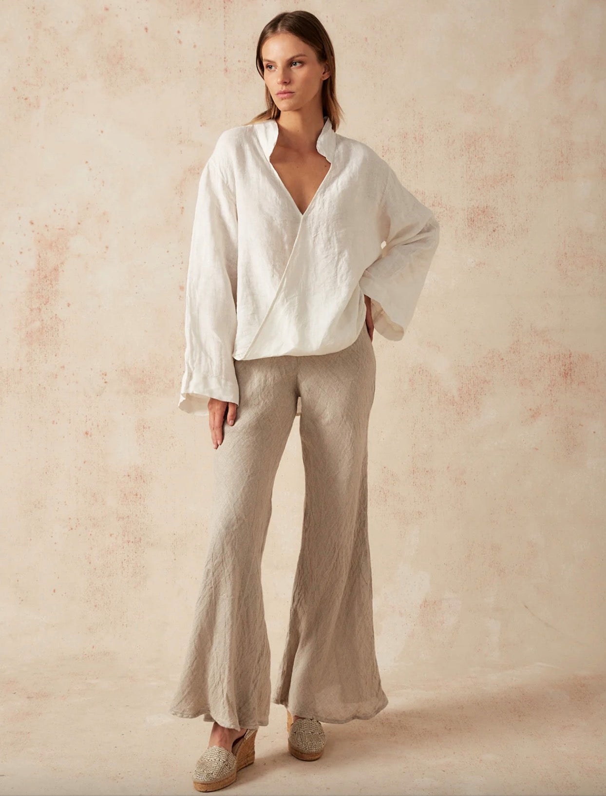 Estilo Emporio Novo Flare Pant - Brasile Natural - LUXAMORE -Pants-Estilo Emporio Novo Flare Pant in Natural 100% Italian linen made in Positano. High-waisted, flare cut. Travel in style. Shop Estilo Emporio Pants.