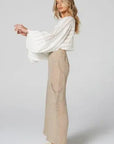 Estilo Emporio Linen Pant Pocket worn by model in natural setting LUXAMORE 